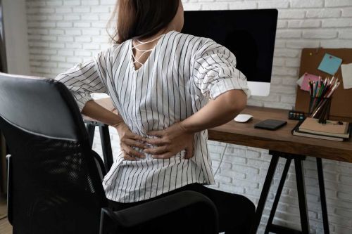 Click Here To Enlarge This Photo Of SITTING WITH BACK PAIN